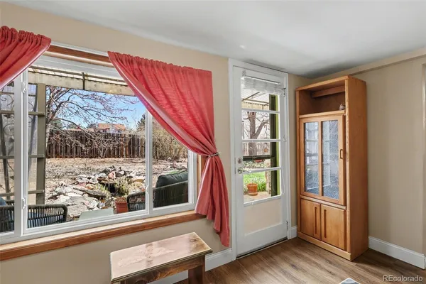 a view of an entryway with wooden floor