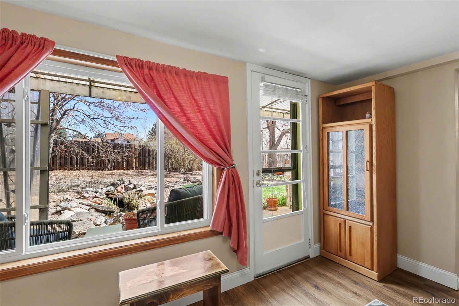 9795 Morrison Road Lakewood, CO 80227 - Photo 14 of 27 a view of an entryway with wooden floor