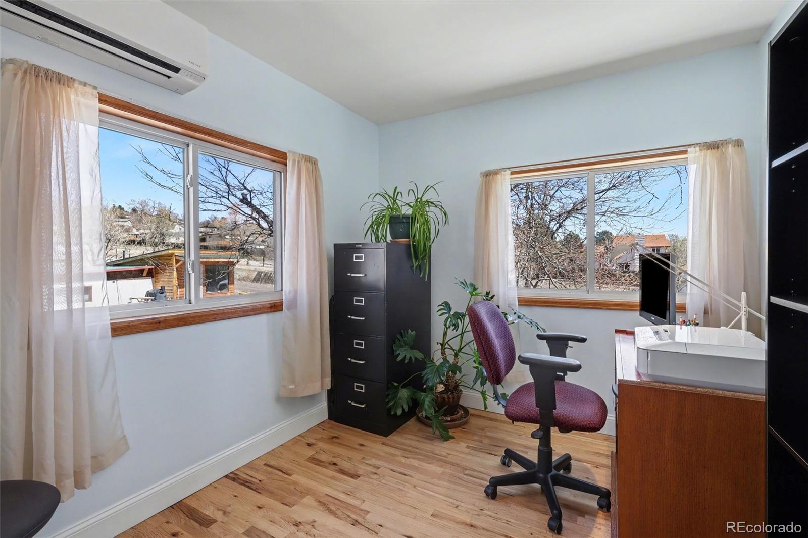 9795 Morrison Road Lakewood, CO 80227 - Photo 16 of 27 a view of a workspace with furniture and a window