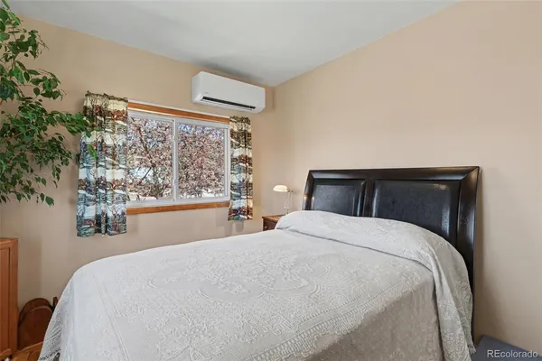 a bedroom with a bed and window