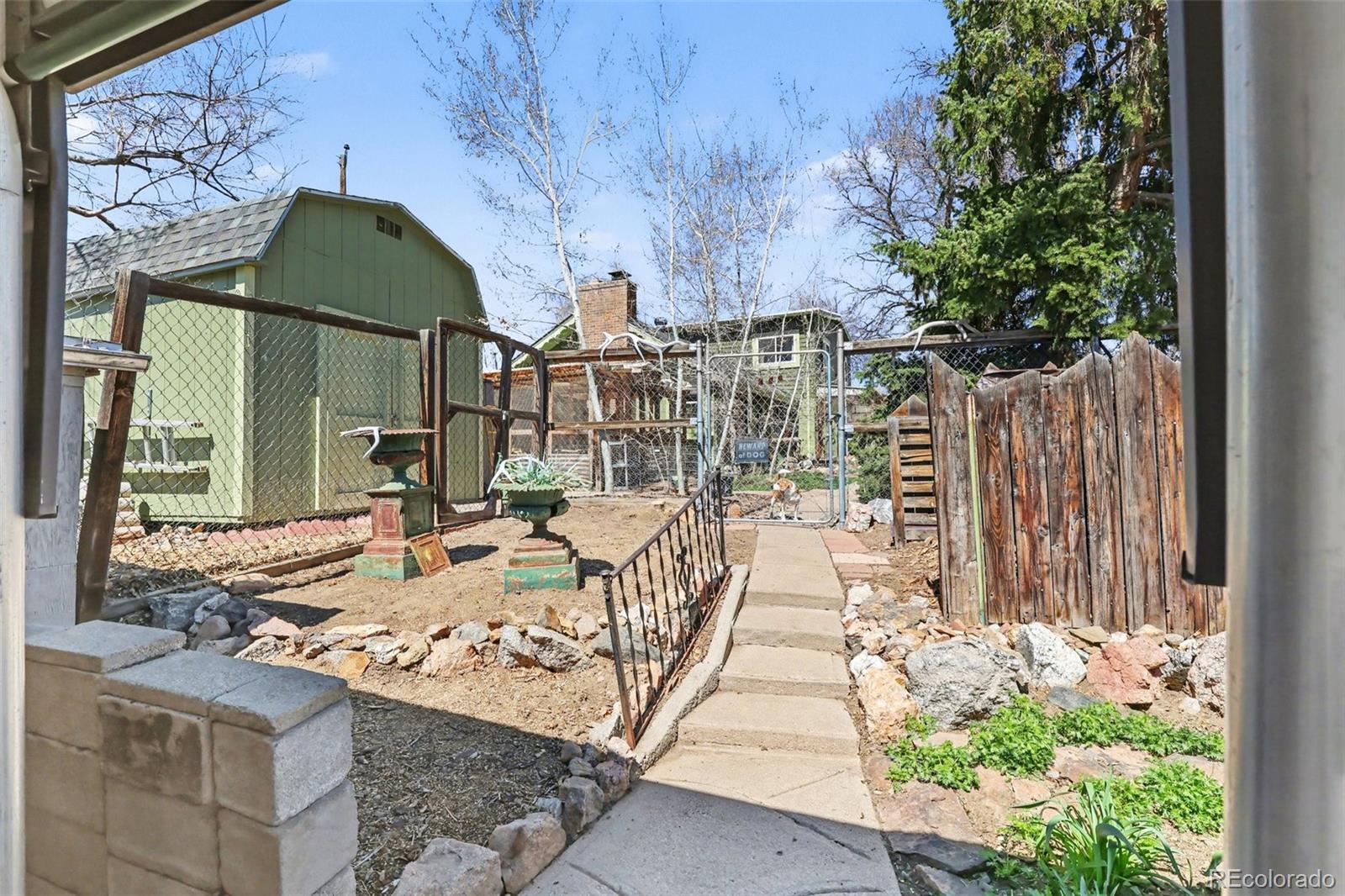 9795 Morrison Road Lakewood, CO 80227 - Photo 21 of 27 a view of balcony with wooden floor and plants