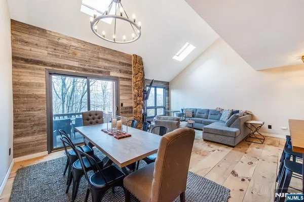 a dining room with furniture and window