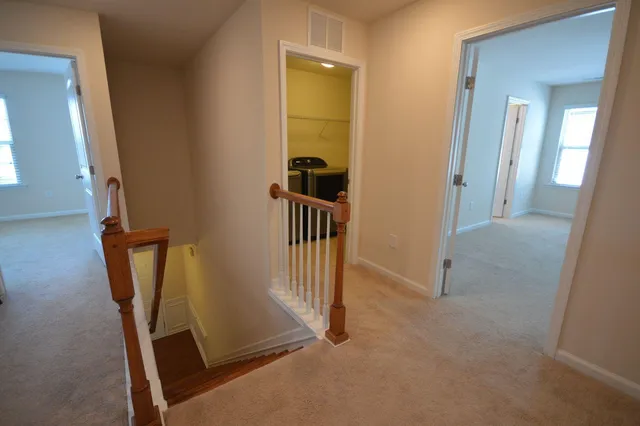 a view of a room with cabinet and mirror