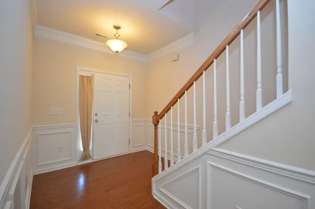 an open kitchen with kitchen island and stainless steel appliances