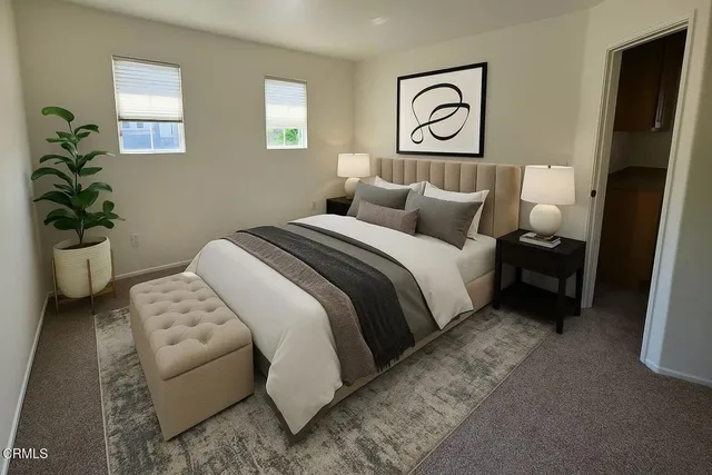 a bedroom with a bed and a couch