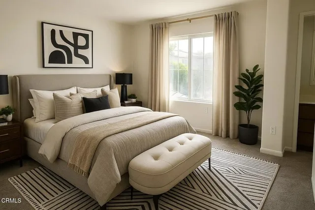 a bedroom with furniture and a window