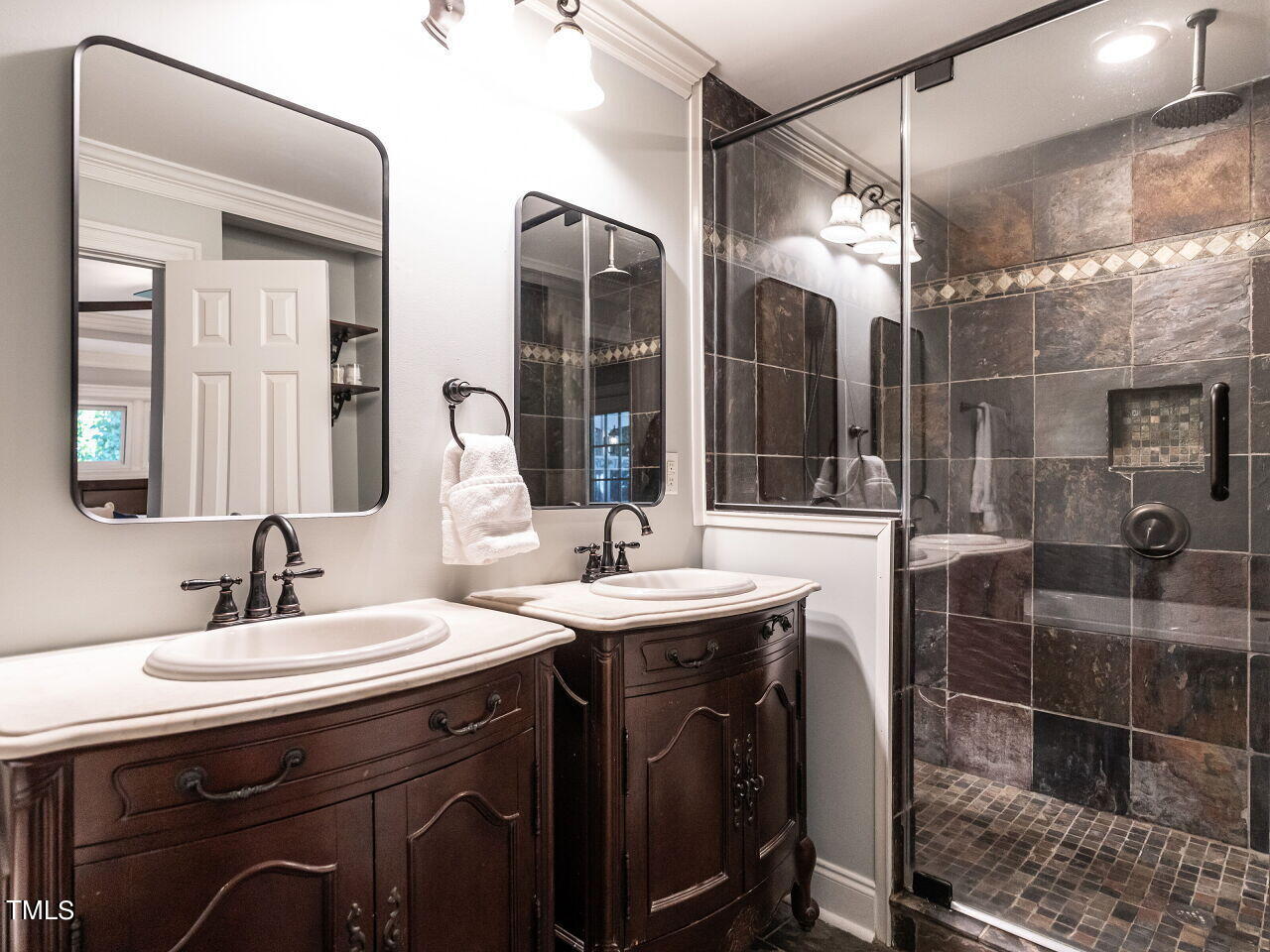 2705 Rothgeb Drive Raleigh, NC 27609 - Photo 21 of 35 Love the contemporary mirrors and dual vanities.