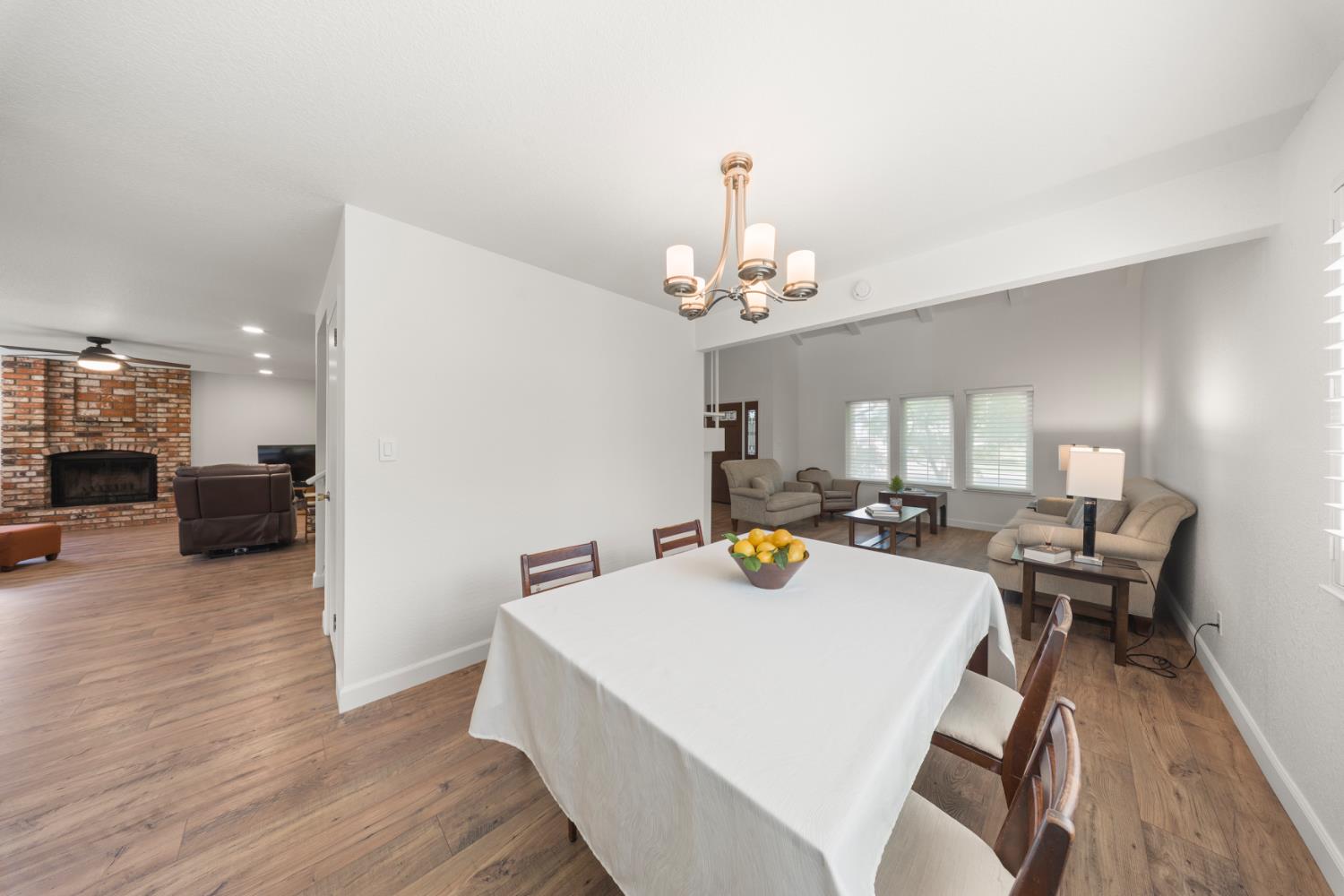 1325 Forest Drive Turlock, CA 95380 - Photo 17 of 28 a view of a dining room with furniture and wooden floor