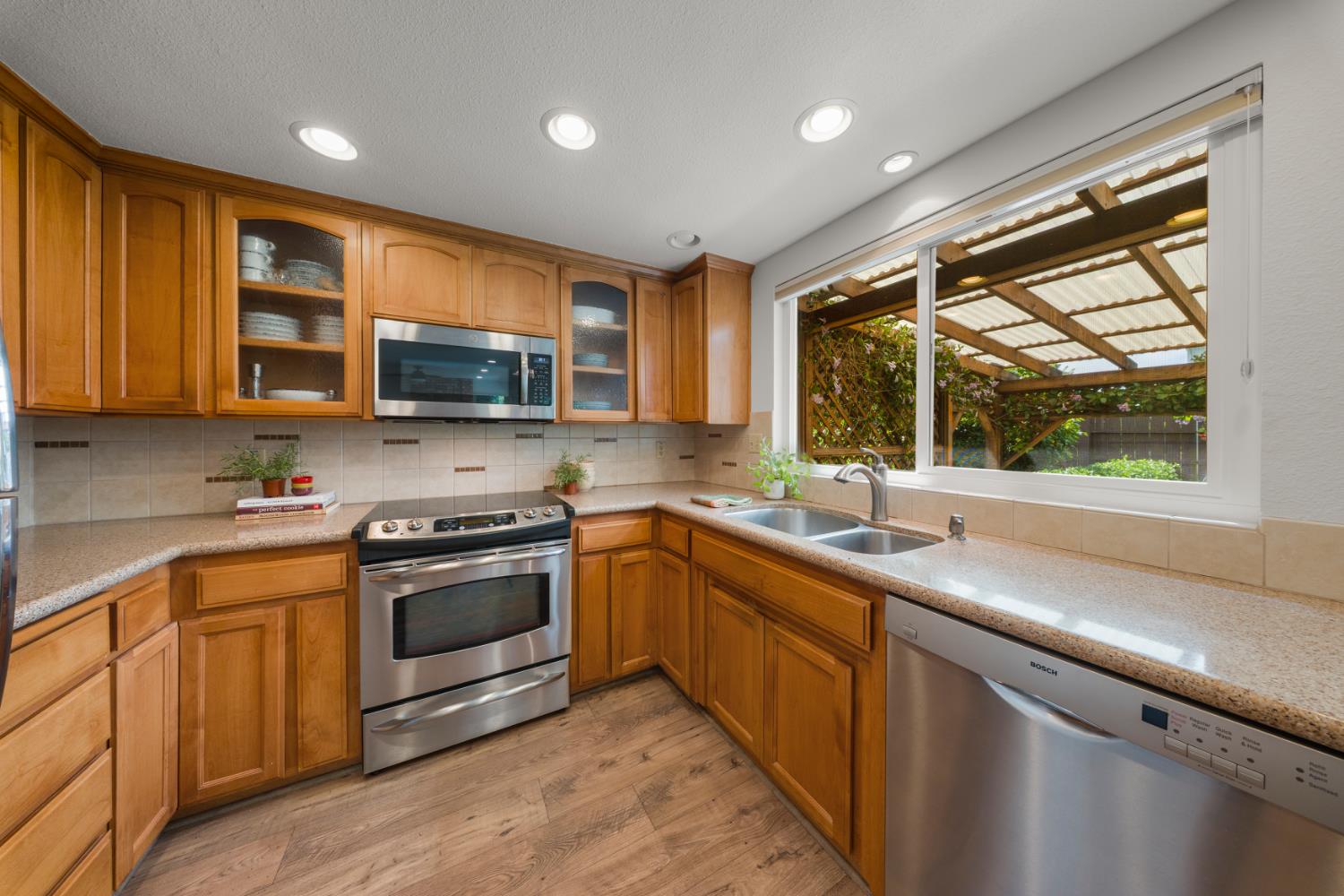 1325 Forest Drive Turlock, CA 95380 - Photo 19 of 28 a kitchen with stainless steel appliances granite countertop a sink stove and microwave