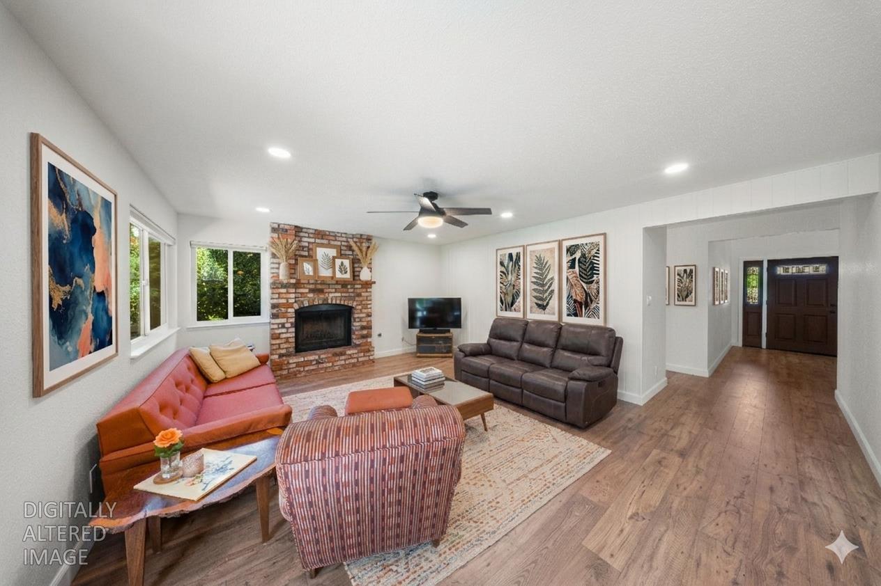 1325 Forest Drive Turlock, CA 95380 - Photo 21 of 28 a living room with furniture and a fireplace