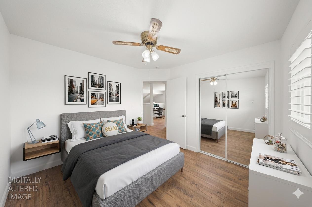 1325 Forest Drive Turlock, CA 95380 - Photo 23 of 28 a bedroom with a bed and wooden floor