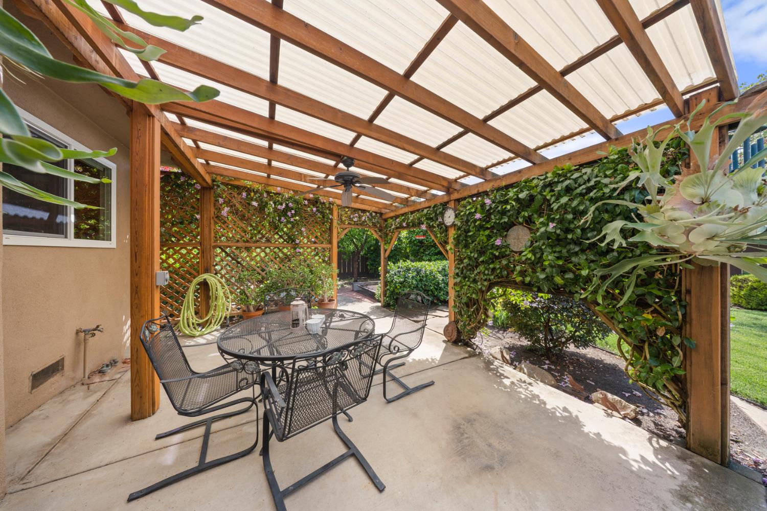 1325 Forest Drive Turlock, CA 95380 - Photo 10 of 28 a view of patio with a table and chairs and potted plants