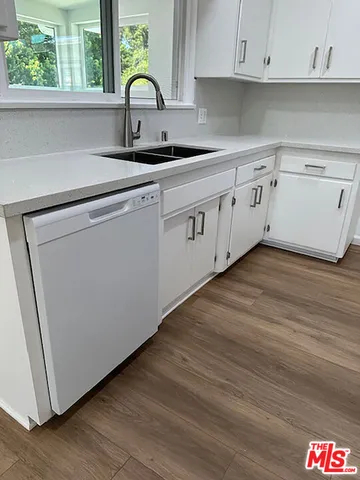 a kitchen with a sink and a window