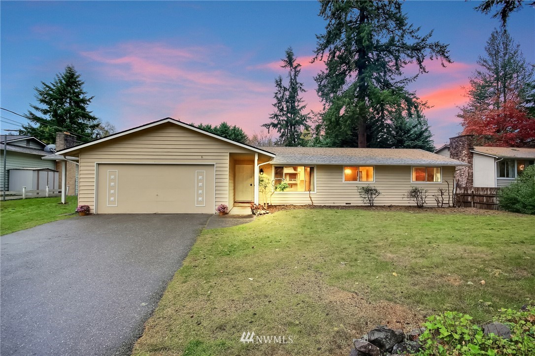 4321 196th Street Southeast Bothell, WA 98012 - Photo 1 of 40 a view of house with a yard and garage