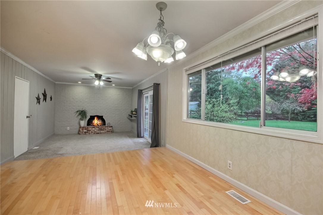 4321 196th Street Southeast Bothell, WA 98012 - Photo 13 of 40 a view of a livingroom with a ceiling fan and window