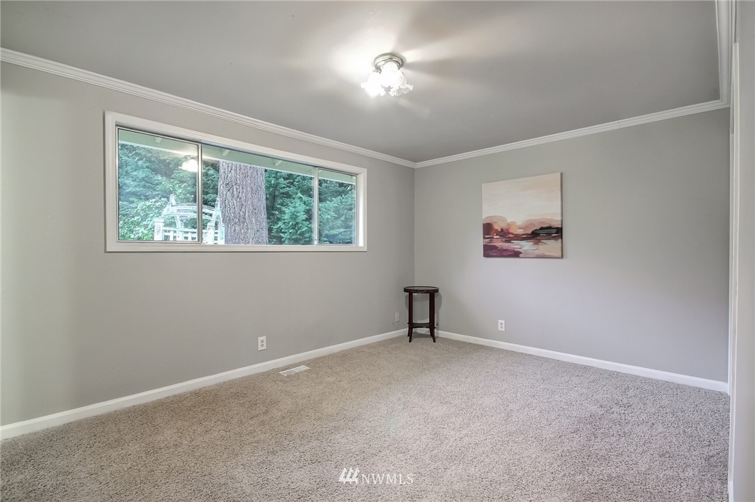4321 196th Street Southeast Bothell, WA 98012 - Photo 26 of 40 a view of an empty room with a window