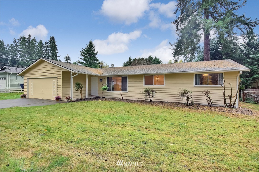 4321 196th Street Southeast Bothell, WA 98012 - Photo 4 of 40 a front view of a house with yard porch and fire pit