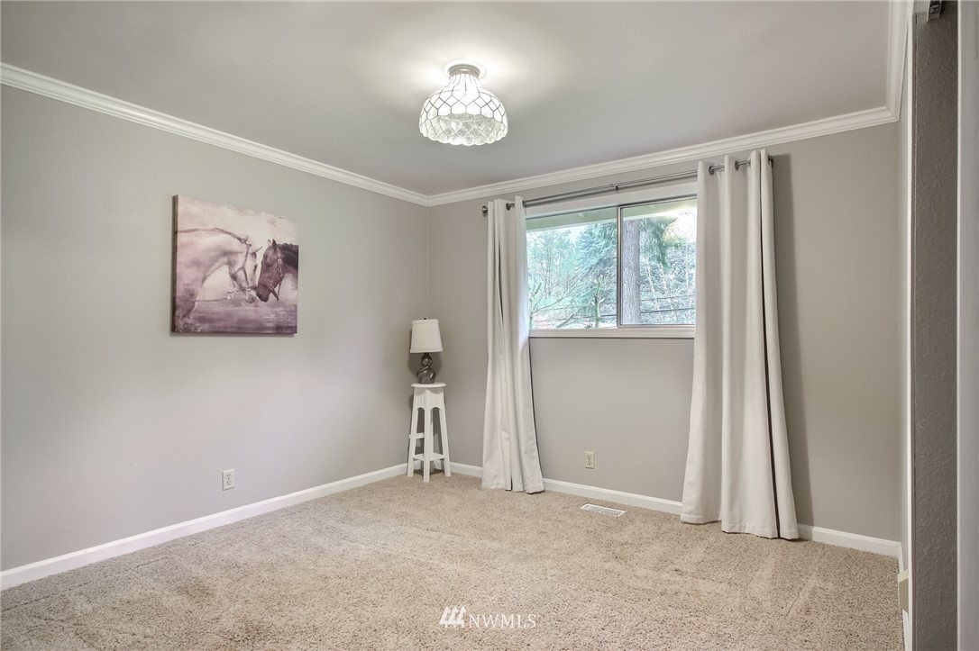 4321 196th Street Southeast Bothell, WA 98012 - Photo 31 of 40 wooden floor in an empty room with a window