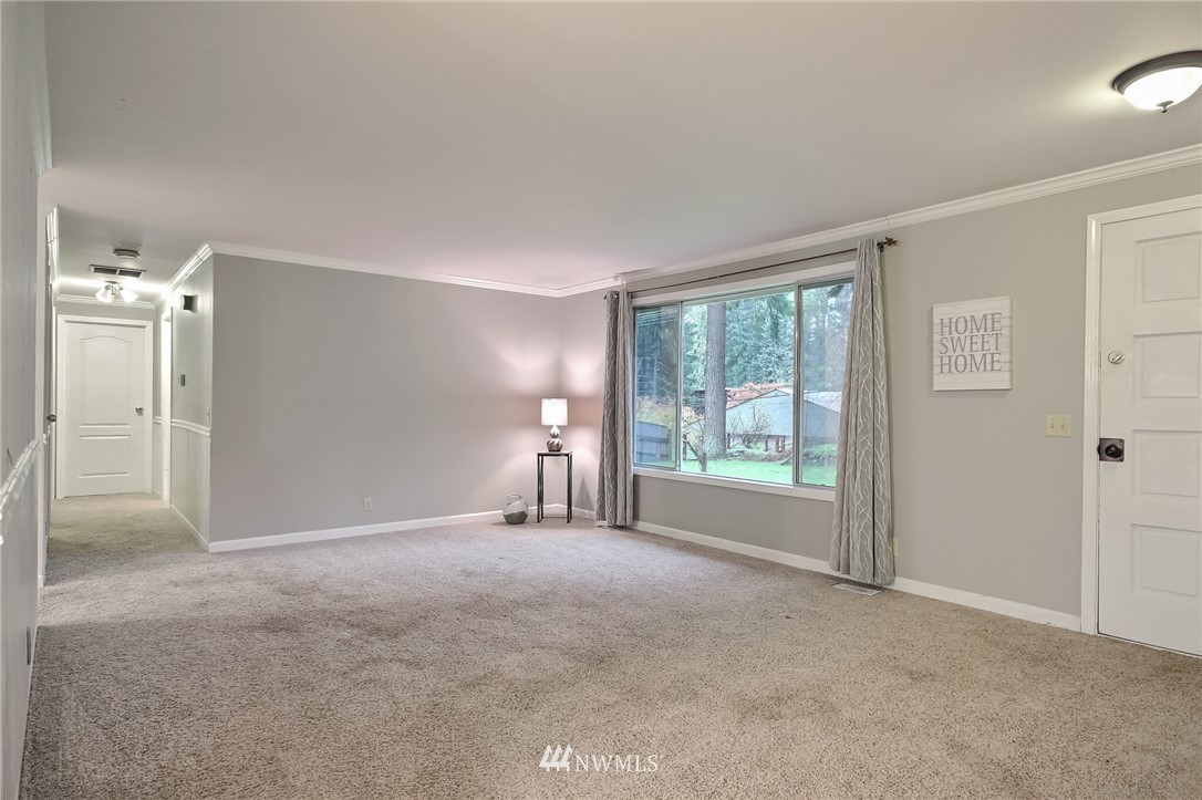 4321 196th Street Southeast Bothell, WA 98012 - Photo 8 of 40 a view of an empty room with a window