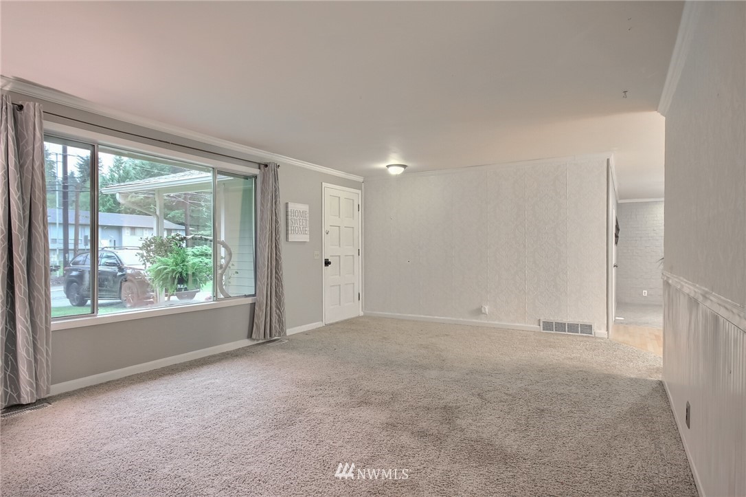 4321 196th Street Southeast Bothell, WA 98012 - Photo 9 of 40 an empty room with windows and view of balcony