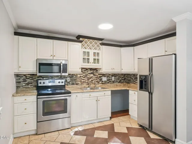 a kitchen with a stove microwave and refrigerator