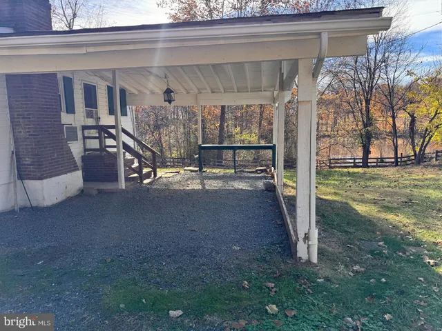 a view of a patio with table and chairs