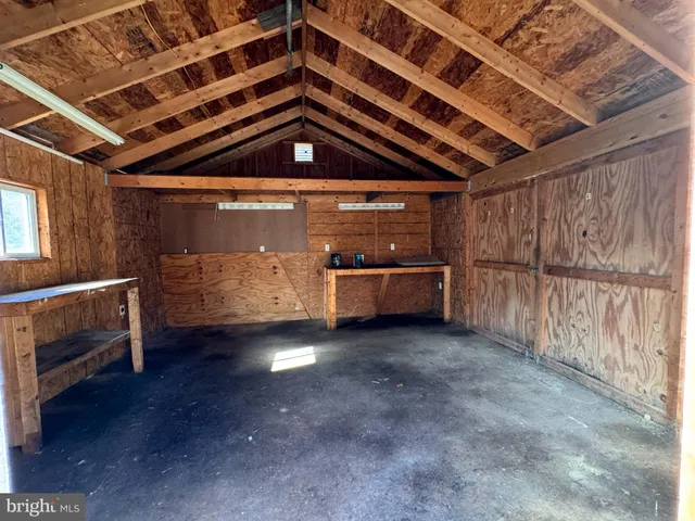 a view of an empty room with a fireplace