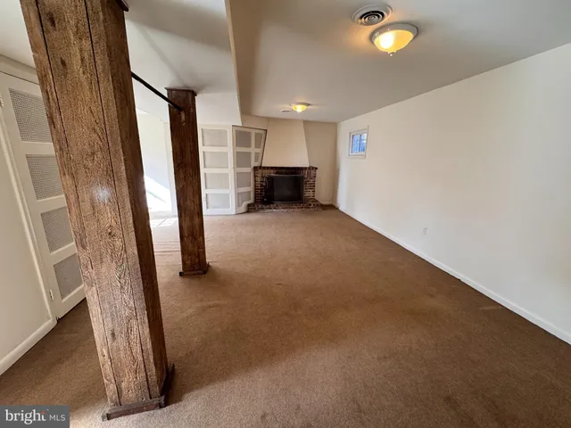a view of entryway and kitchen with furniture