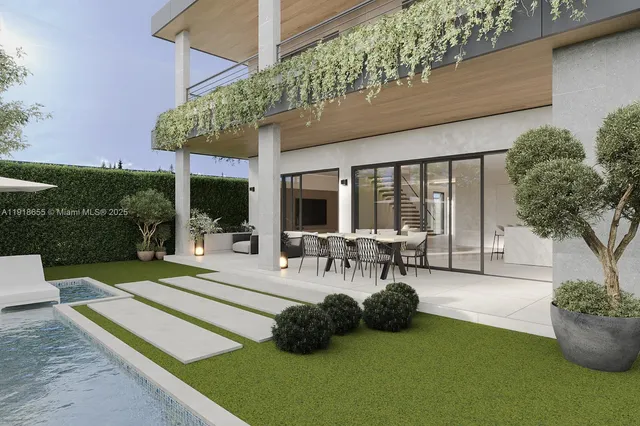 a view of a patio with table and chairs potted plants and a large tree