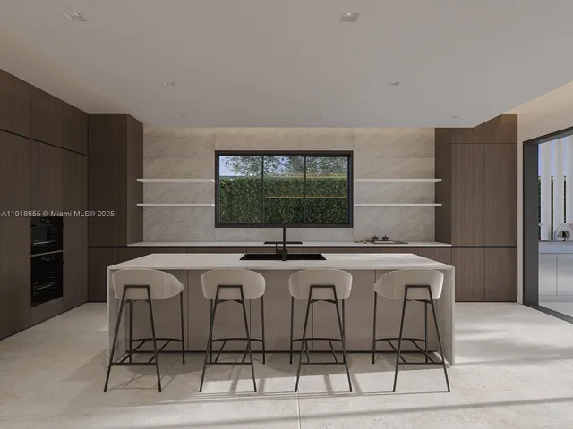 a kitchen with stainless steel appliances a sink and a refrigerator