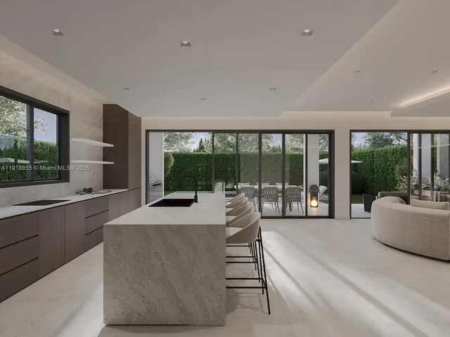 a living room with furniture and large windows