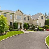 a front view of a house with a yard and porch