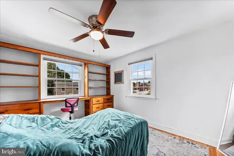 a bed room with a bed and a window