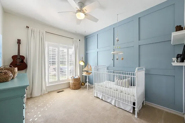 a bedroom with furniture and a window