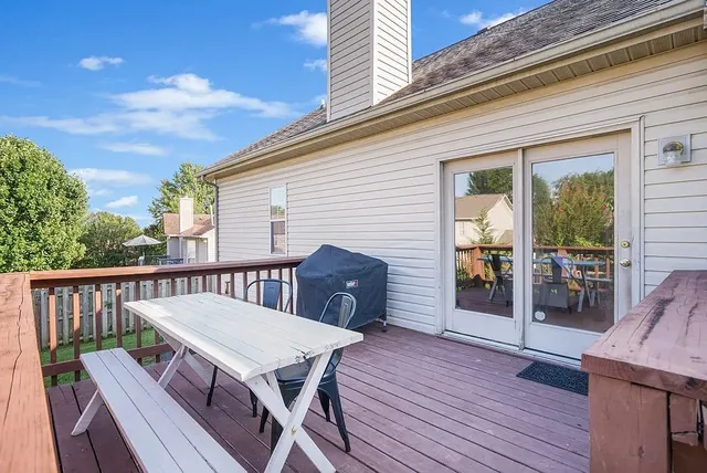 a view of a deck with furniture