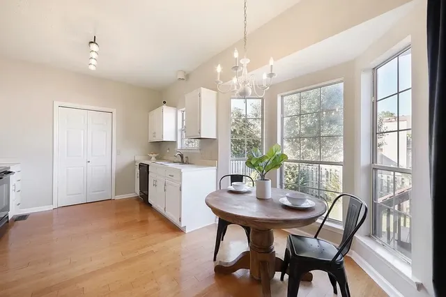 a view of a dining room with furniture window and outside view