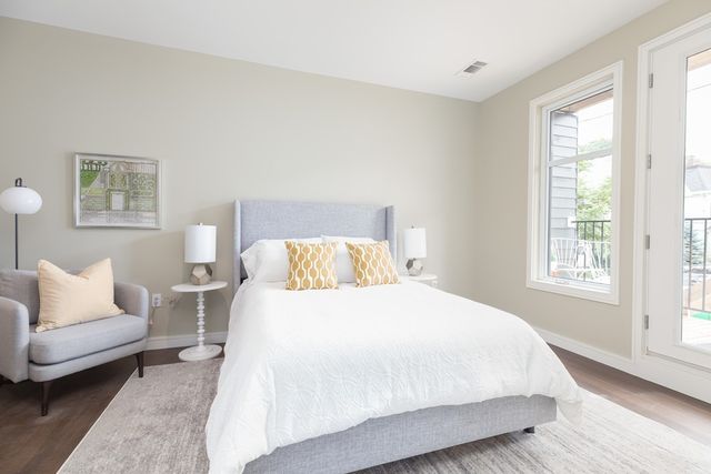 a bedroom with a bed and a couch