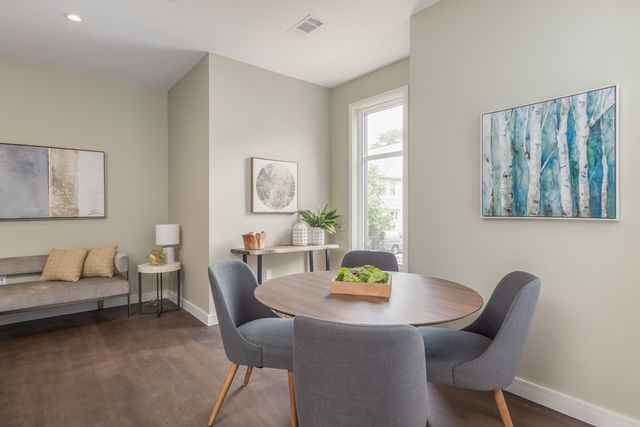 a view of a dining room with furniture and window