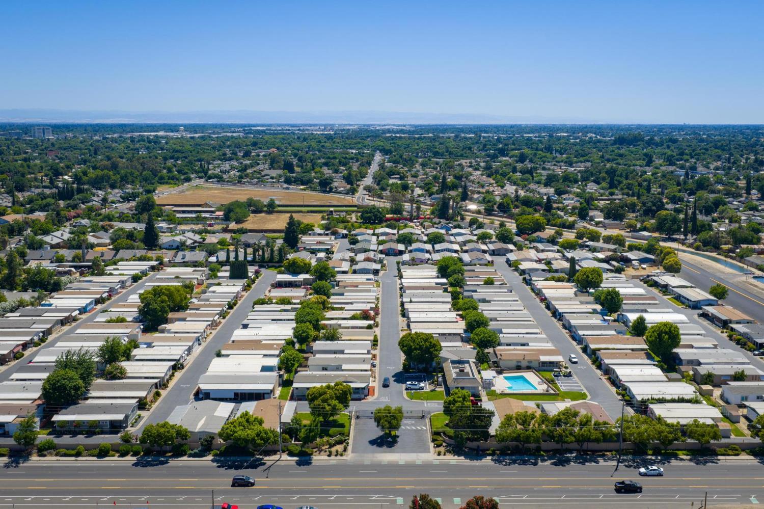 1200 South Carpenter Road, Unit 4 Modesto, CA 95351 - Photo 30 of 31 Aerial perspective of a structured community featuring numerous residential units