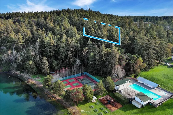 an aerial view of a house with a lake view