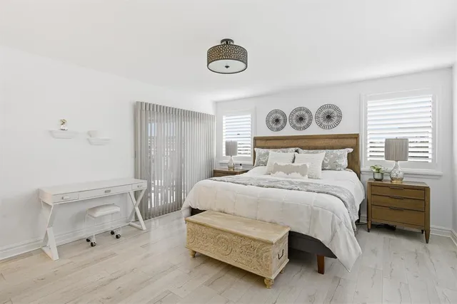 a bedroom with a bed and a table