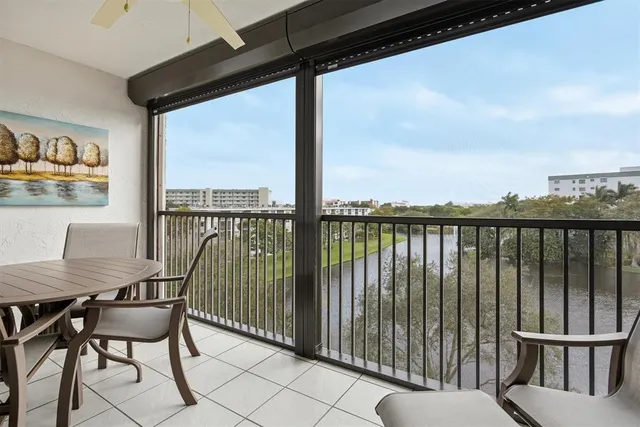 a view of a balcony with furniture