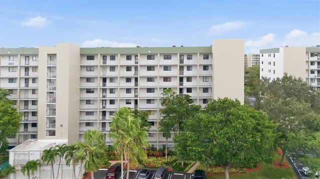 a view of a building with a garden