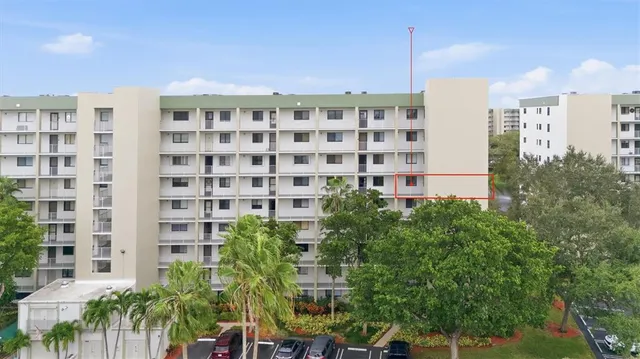 a view of a building with a garden