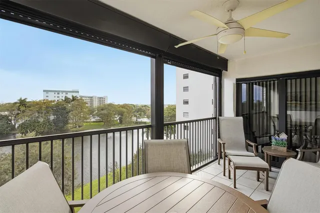 a view of balcony with furniture