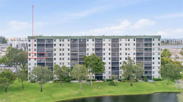 a front view of a building with a garden