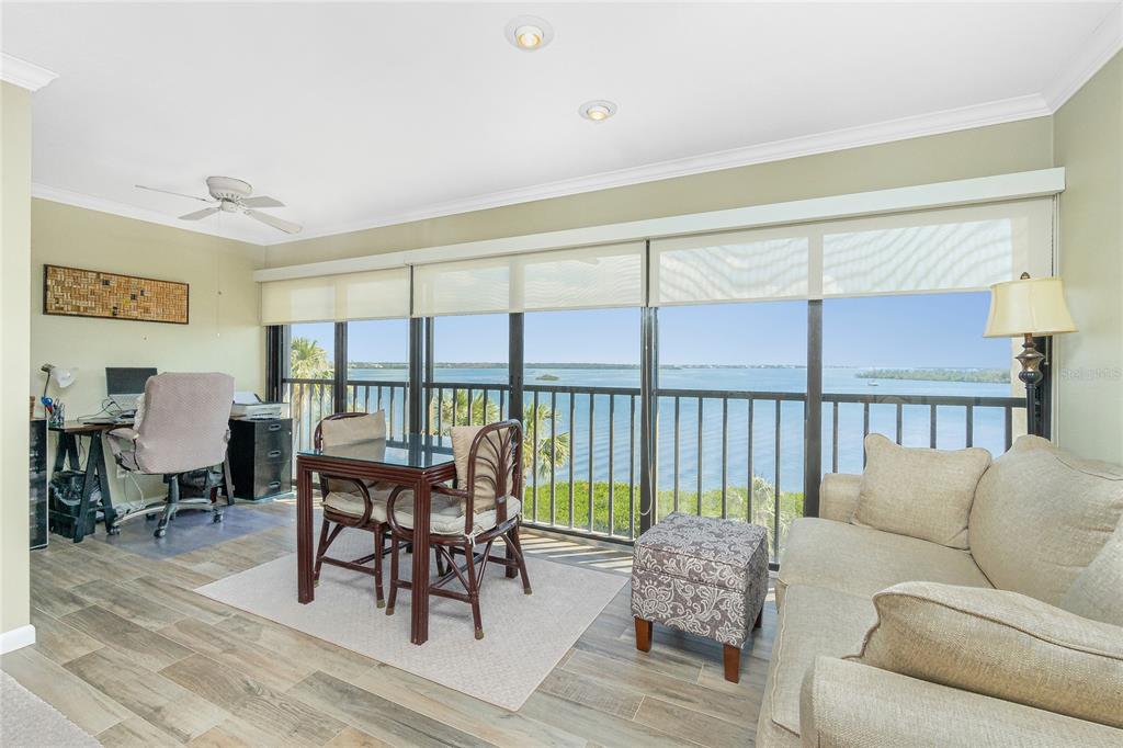 1591 Beach Road, Unit 403 Englewood, FL 34223 - Photo 14 of 61 a living room with furniture and a large window