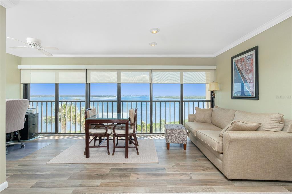 1591 Beach Road, Unit 403 Englewood, FL 34223 - Photo 2 of 61 a living room with furniture and a window