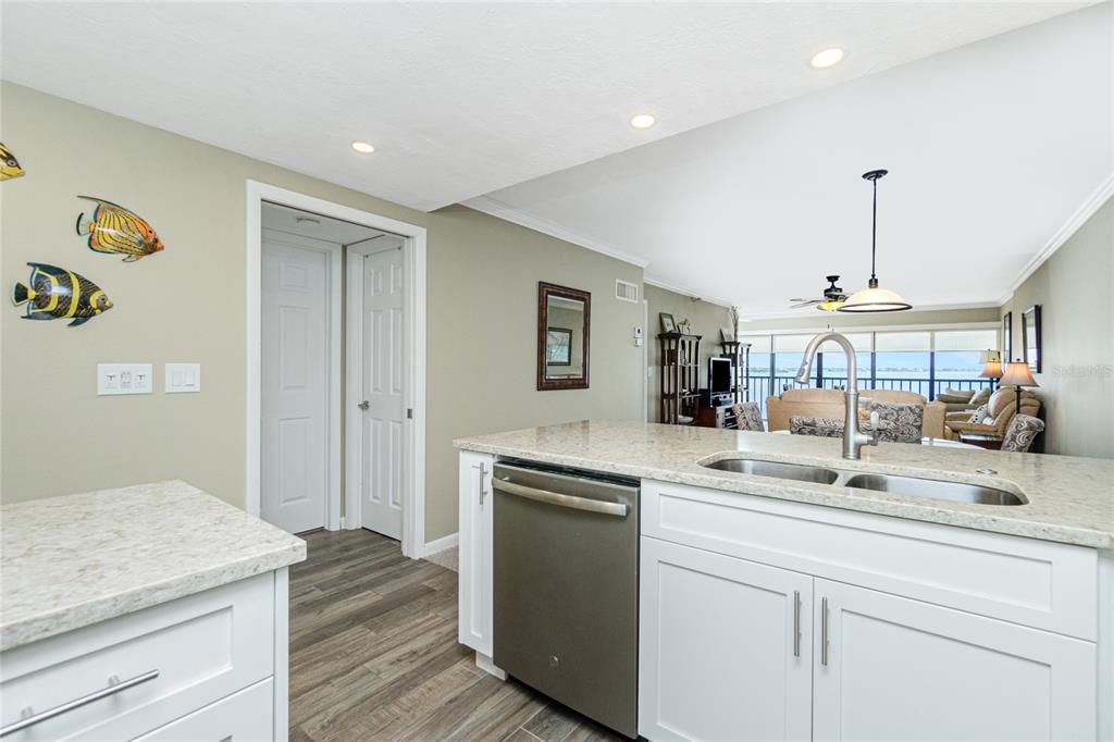 1591 Beach Road, Unit 403 Englewood, FL 34223 - Photo 24 of 61 a kitchen with a sink and a refrigerator