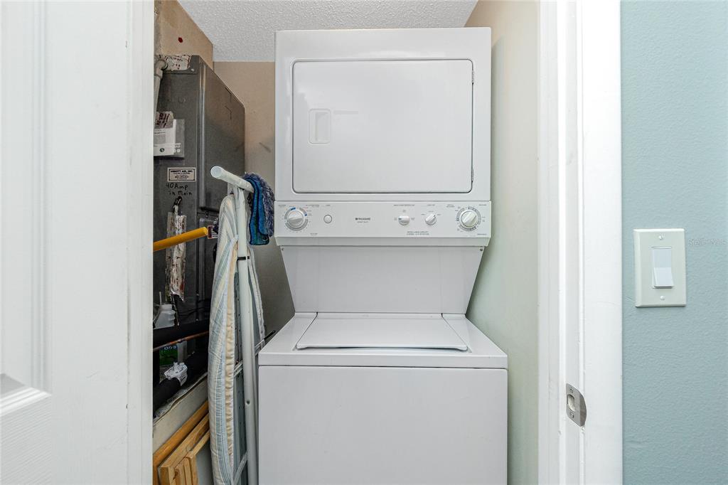 1591 Beach Road, Unit 403 Englewood, FL 34223 - Photo 34 of 61 a utility room with dryer and washer